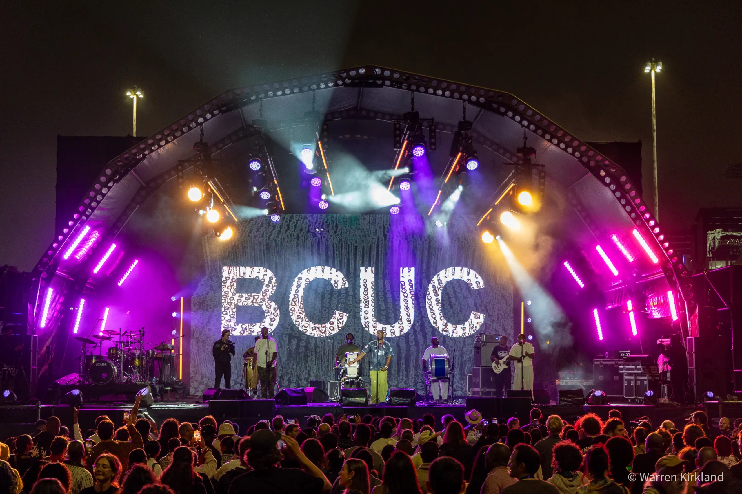 BCUC performing to a crowd on a large festival stage