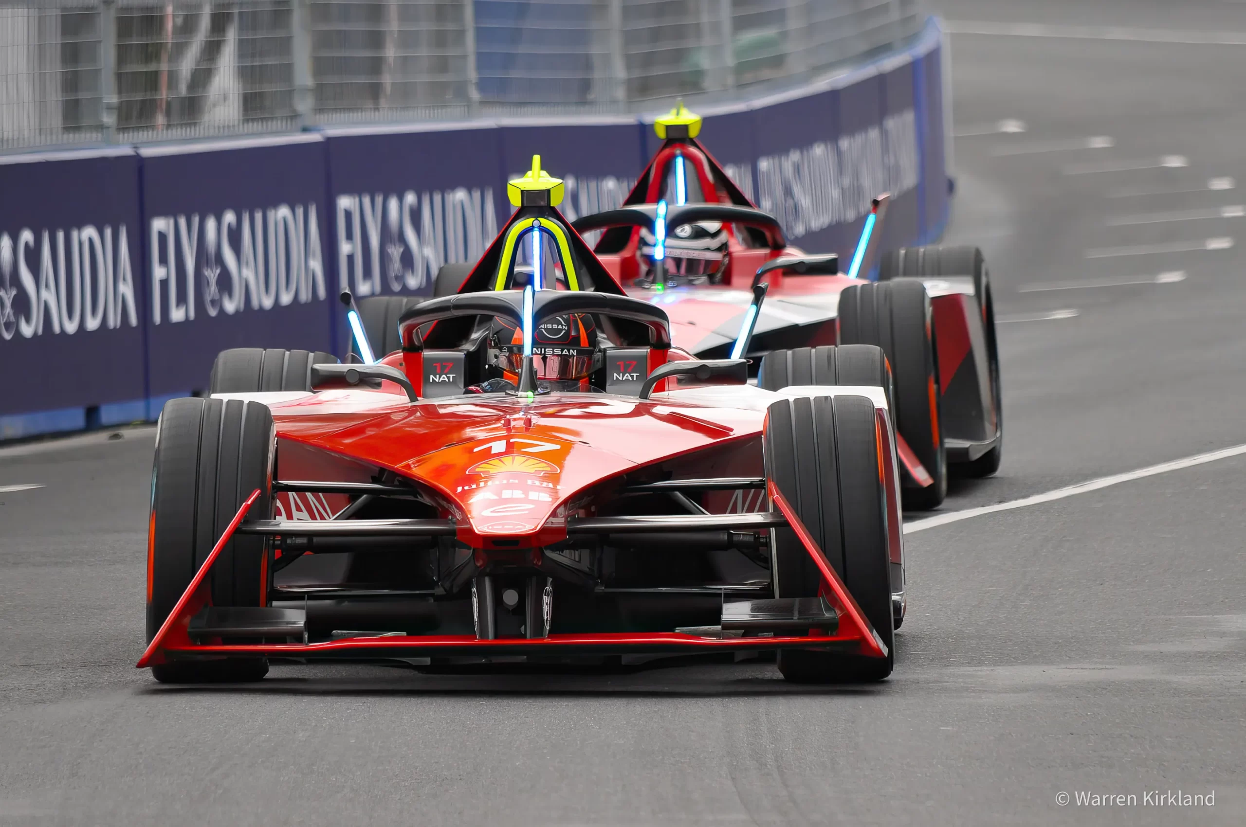 Nissan Formula E cars racing head-on close together
