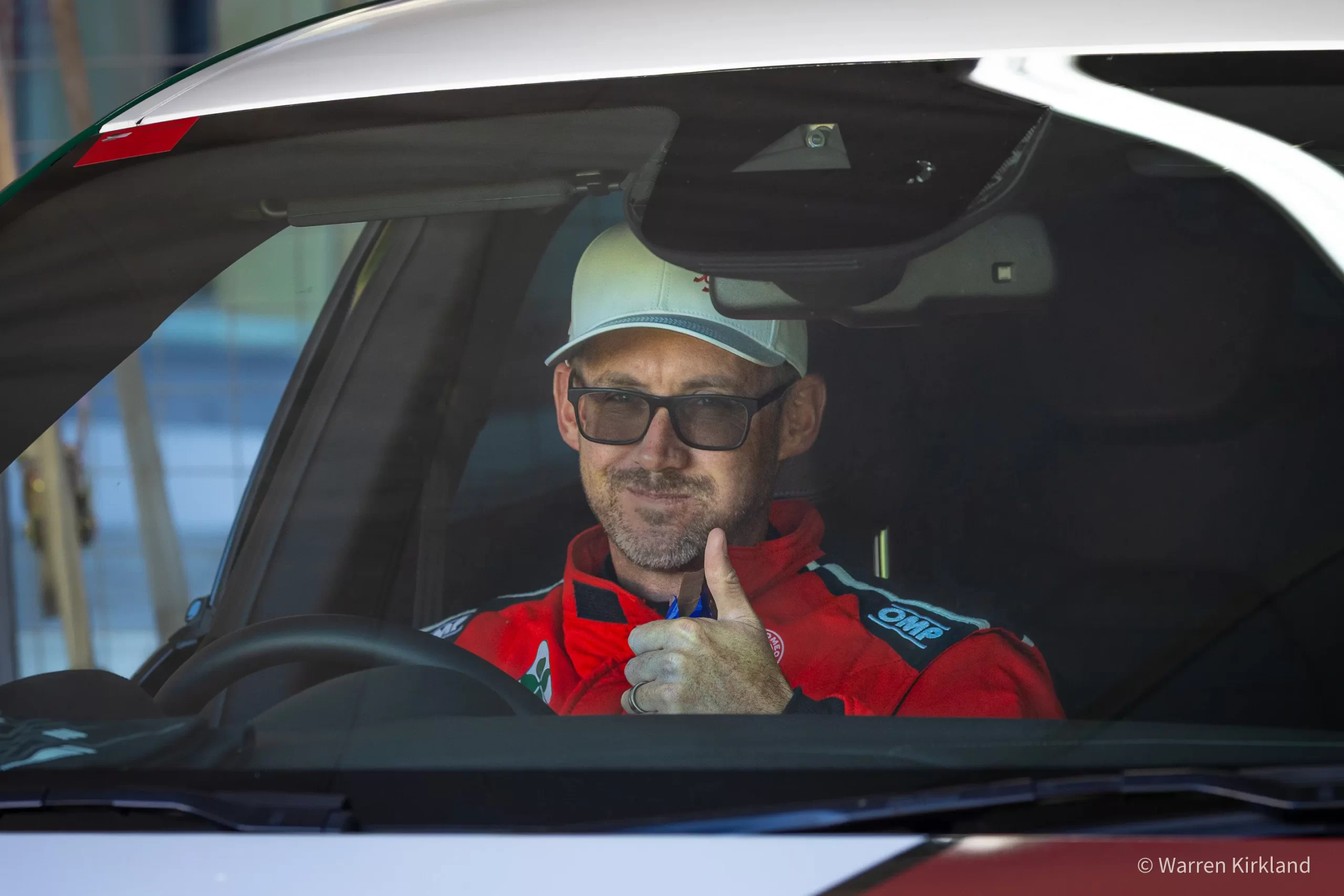 Racing driver giving a thumbs up from the cockpit, Speed Classic Cape Town