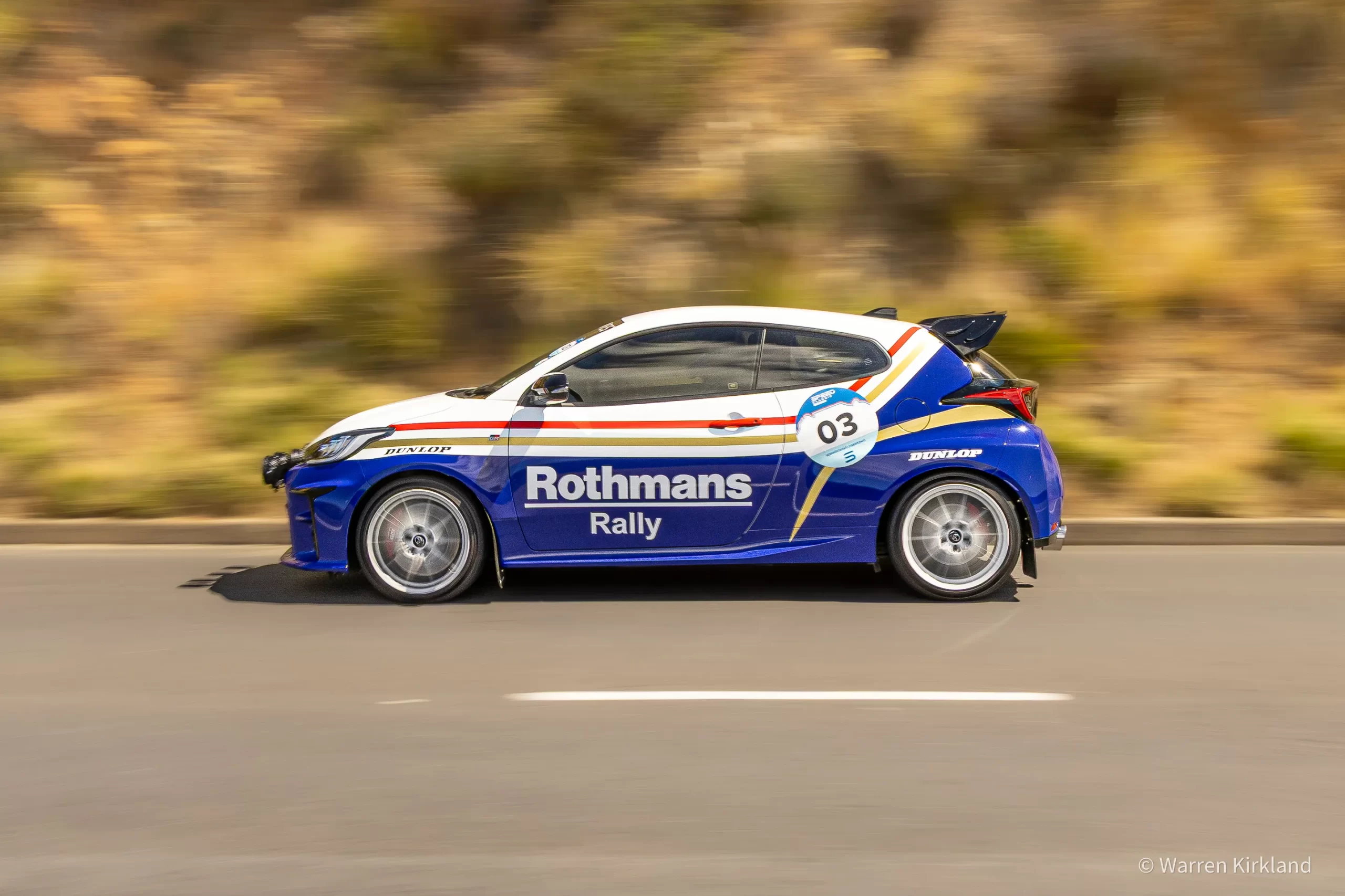 Rothmans rally car speeding along a dirt road, side profile, Speed Classic Cape Town