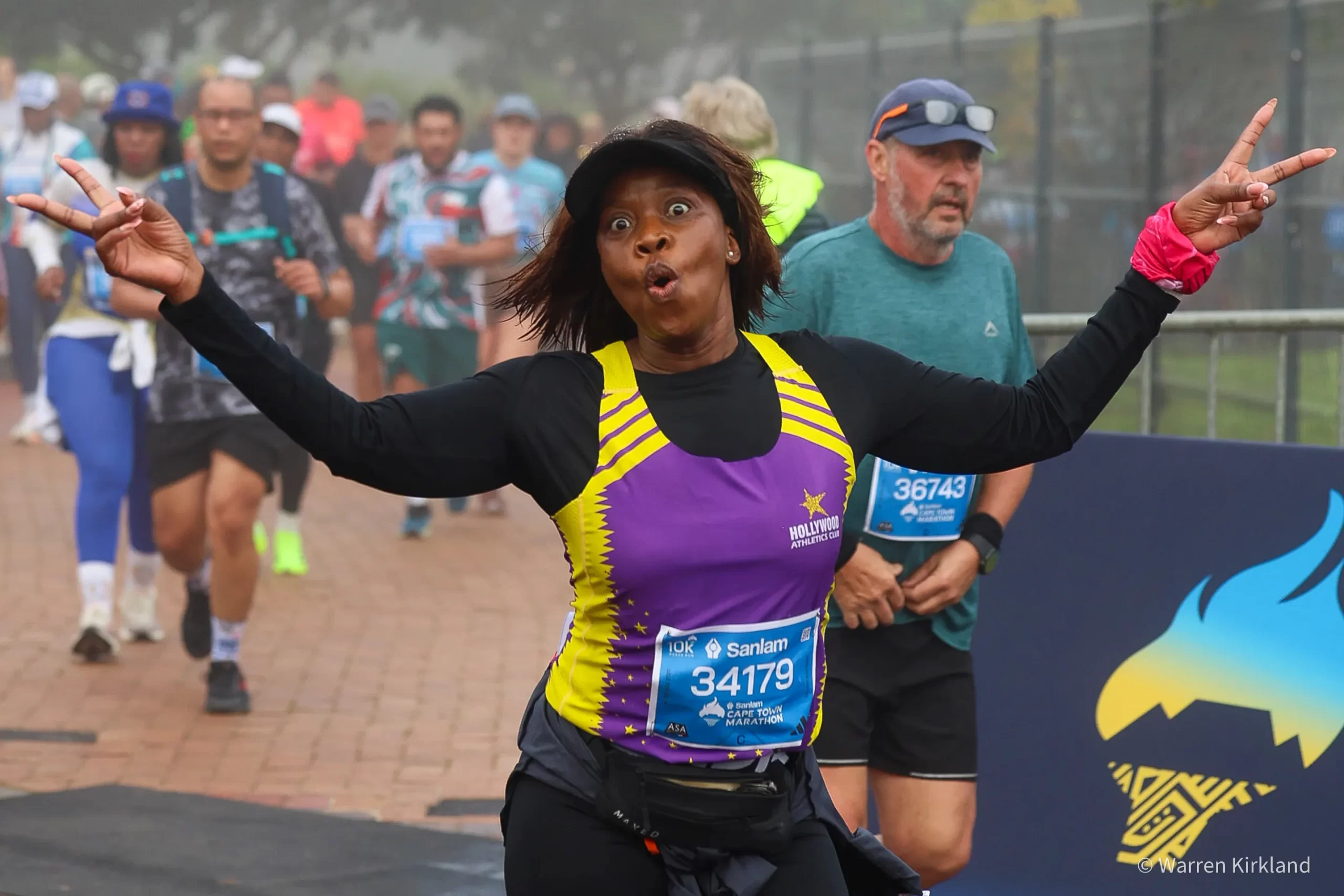 Runner celebrating with a peace sign, Cape Town Marathon