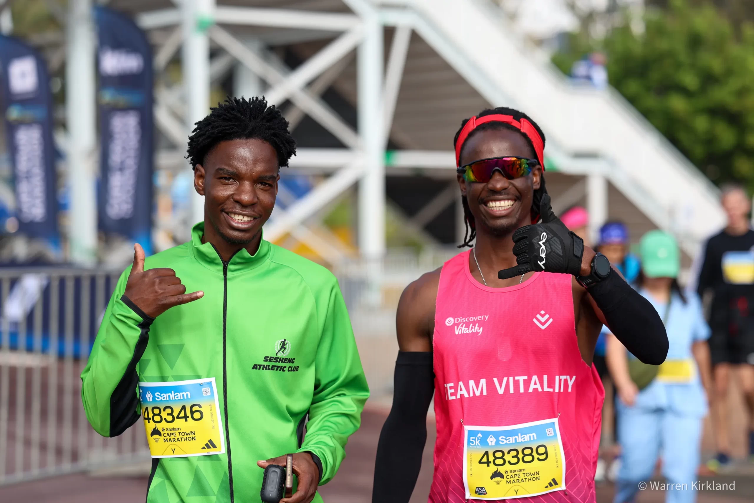Two runners smiling together after finishing, Cape Town Marathon