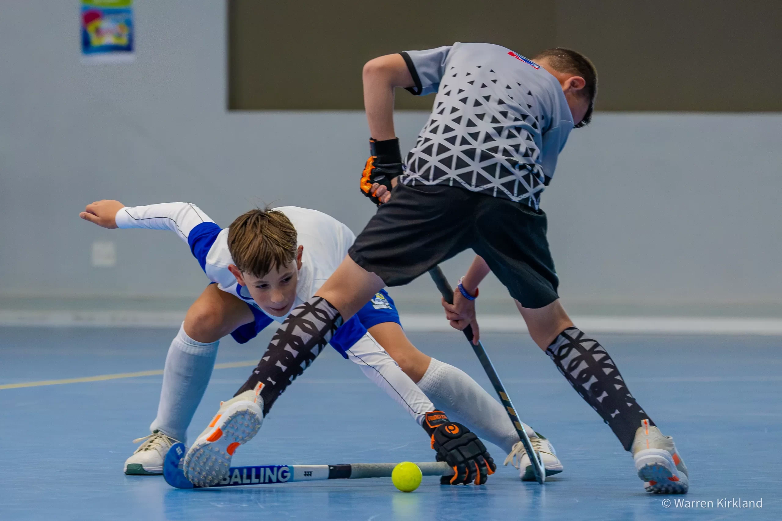 Junior indoor hockey players contesting the ball on court, PSI South Nationals