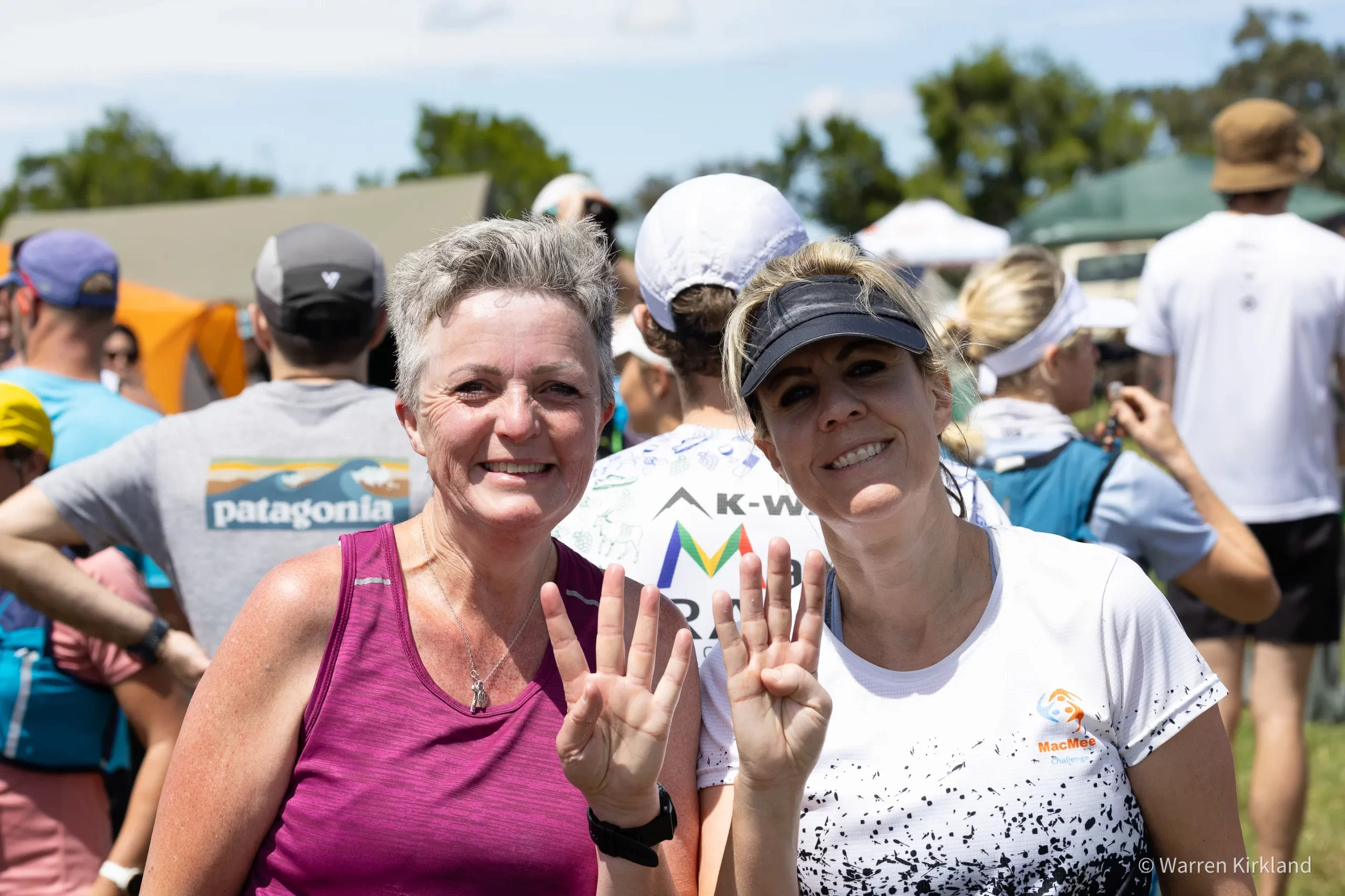 Two runners smiling and gesturing to the camera, Backyard Ultra Series